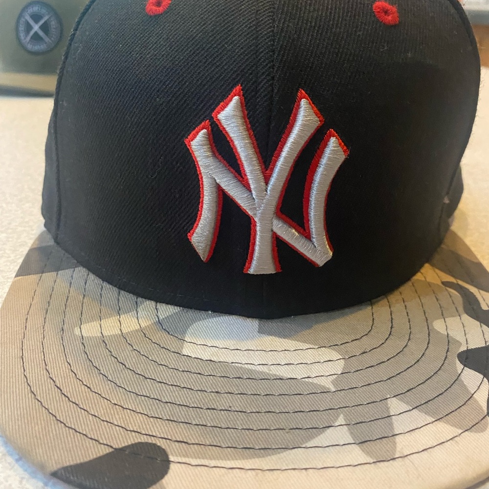 New Era Black and Camouflage Hat